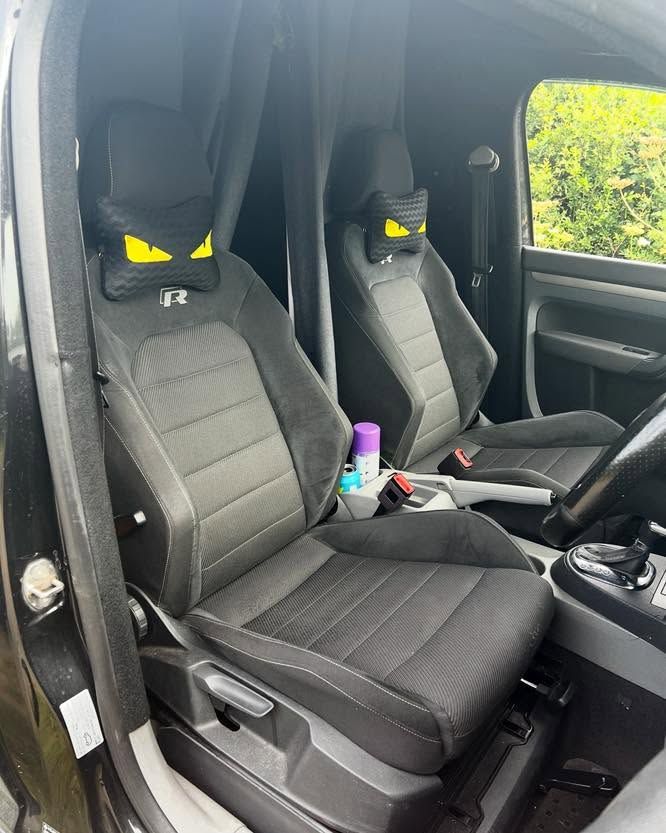 Caddy cab after: Golf R seats and black carpeted interior
